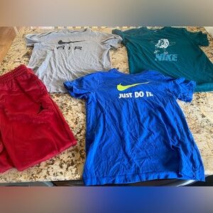 Boys large nike tees and red Jordan pants